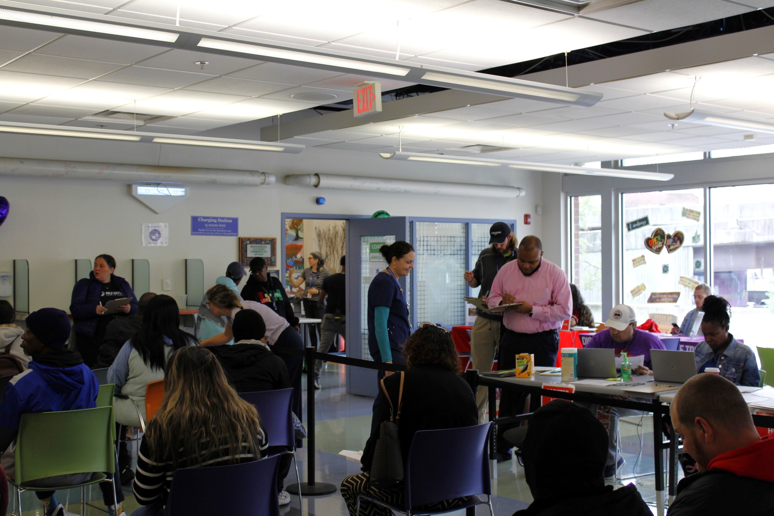 Staff and clients in the lobby during the Coat and Flu Drive.