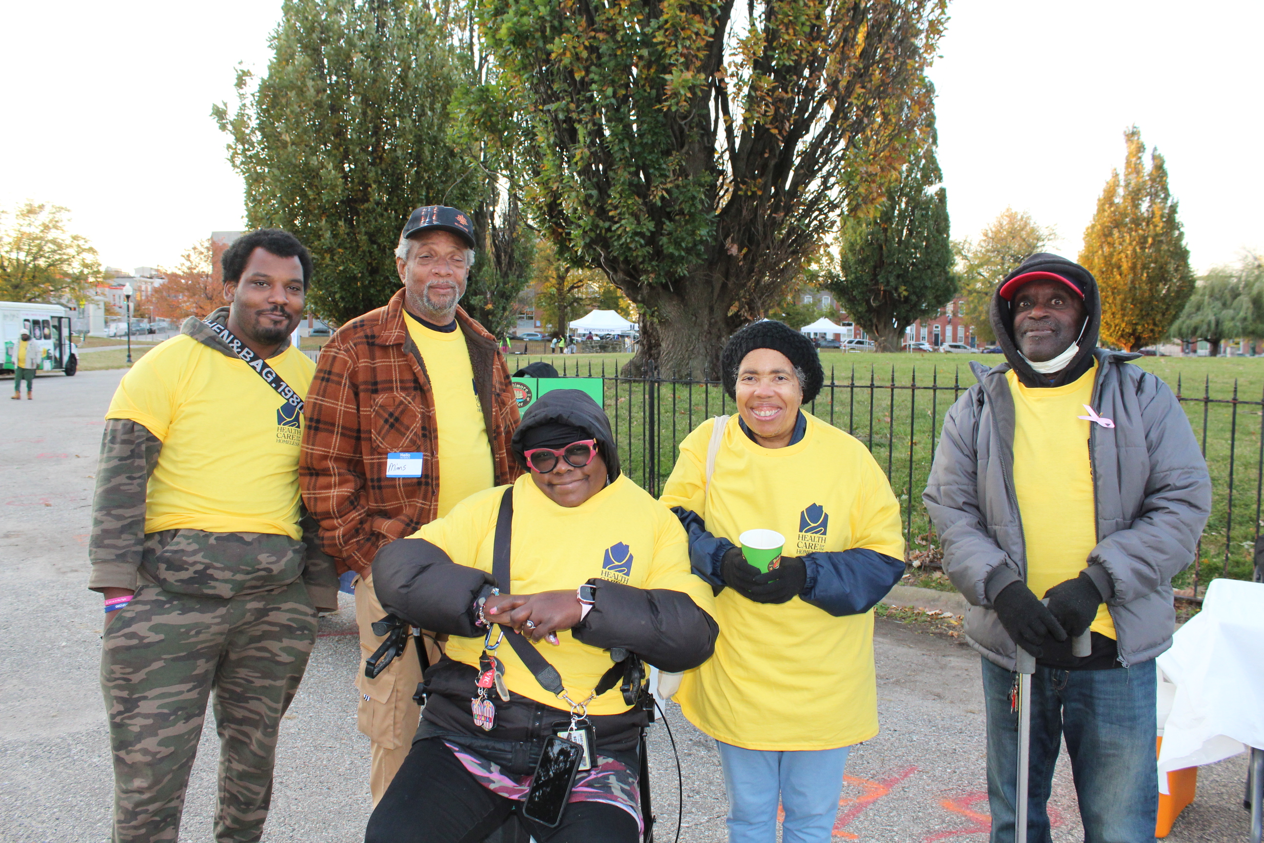 A group of volunteers in yellow shirts.