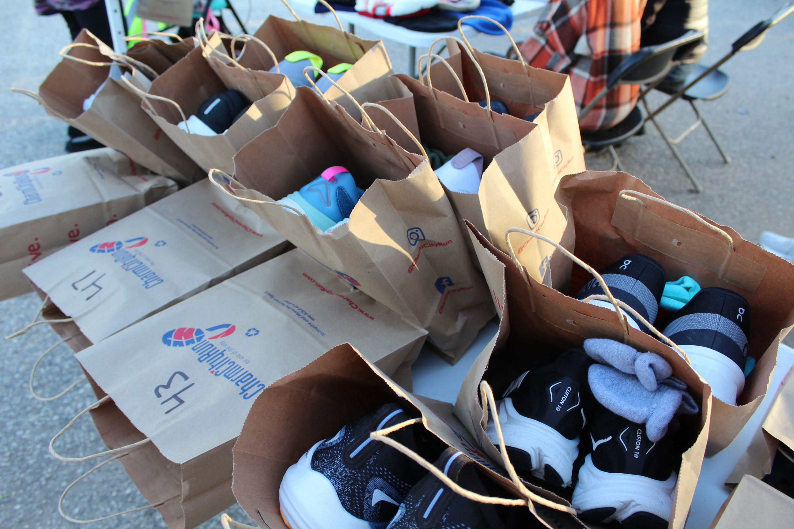 Brown bags filled with shoes.