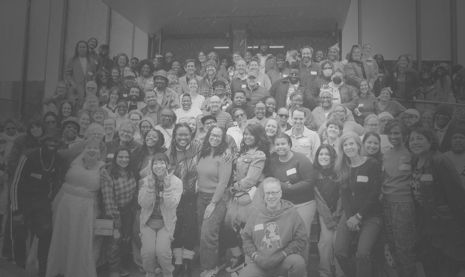 Staff photo on steps outside of a building