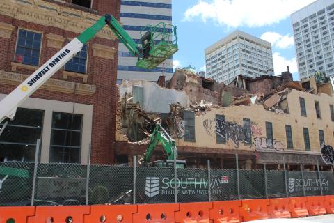 An excavator at the construction site of Sojourner Place at Park.