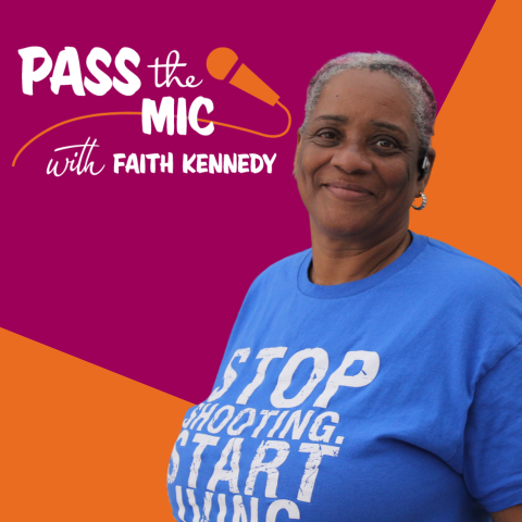 A dark-skinned woman with grey hair and a blue shirt with the Pass the Mic graphic in the upper left corner and a purple and orange background.