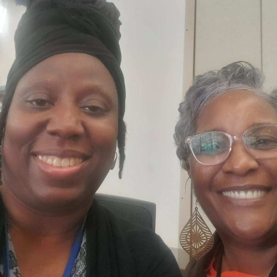 Two Black women, Chief Behavioral Officer Lawanda Williams and Therapist Case Manager Tammy Montague, smiling at the camera. 