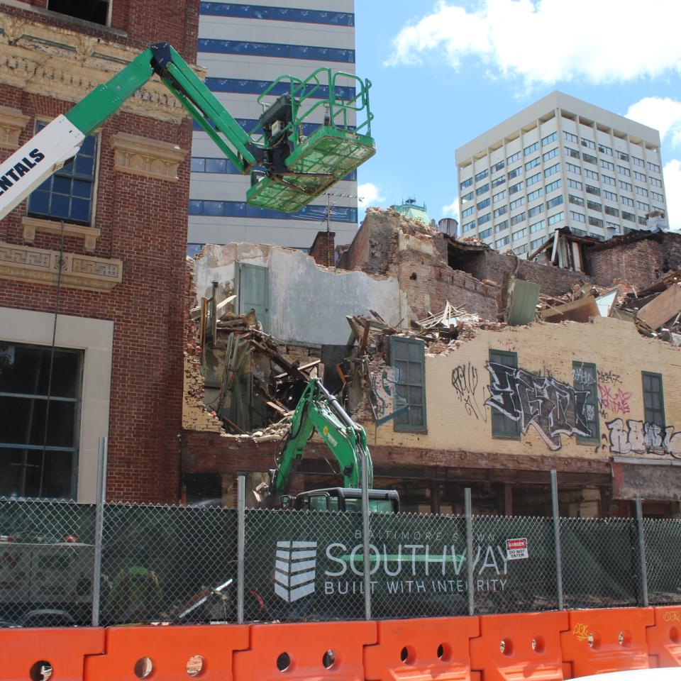 An excavator at the construction site of Sojourner Place at Park.