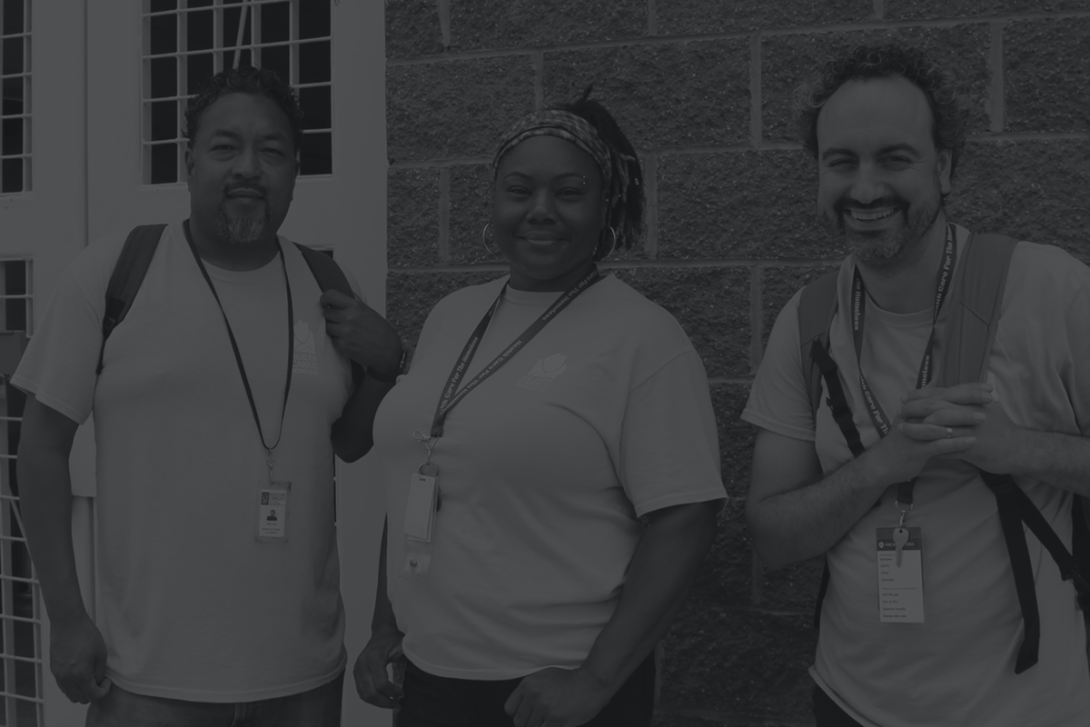 Three members of the street medicine team wearing backpacks.